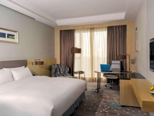 Imagen de la habitación del Hotel Pullman Changshu Leeman. Foto 20