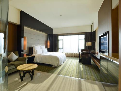 Imagen de la habitación del Hotel Pullman Dongguan Changan. Foto 13