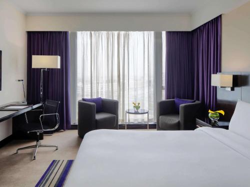 Imagen de la habitación del Hotel Pullman Dubai Creek City Centre. Foto 9