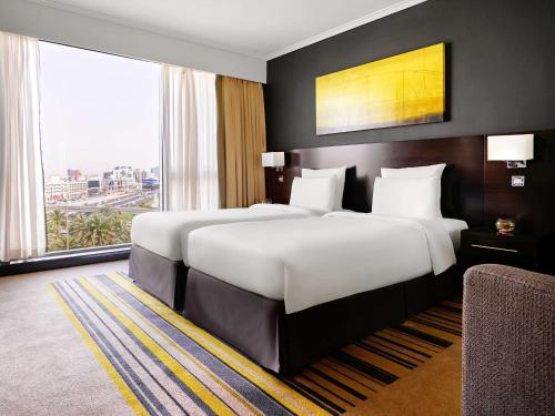Imagen de la habitación del Hotel Pullman Dubai Creek City Centre. Foto 17