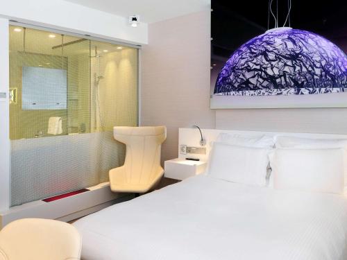 Imagen de la habitación del Hotel Pullman Eindhoven Cocagne. Foto 15