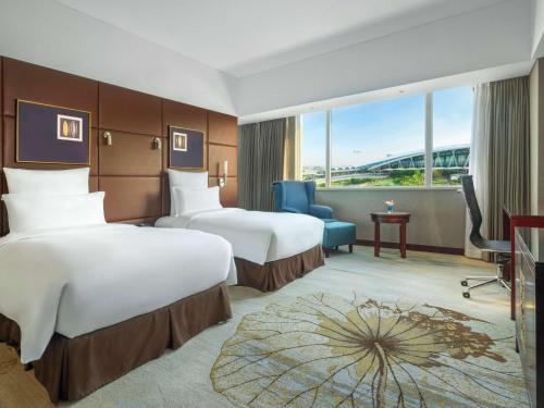 Imagen de la habitación del Hotel Pullman Guangzhou Baiyun Airport. Foto 15