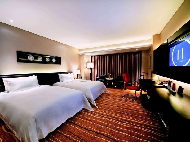 Imagen de la habitación del Hotel Pullman Guiyang. Foto 12