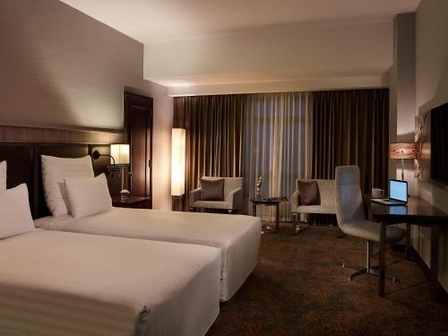 Imagen de la habitación del Hotel Pullman Hanoi. Foto 9