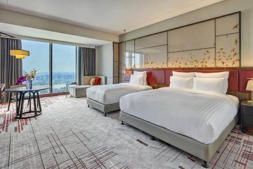 Imagen de la habitación del Hotel Pullman Huizhou Kaisa. Foto 5