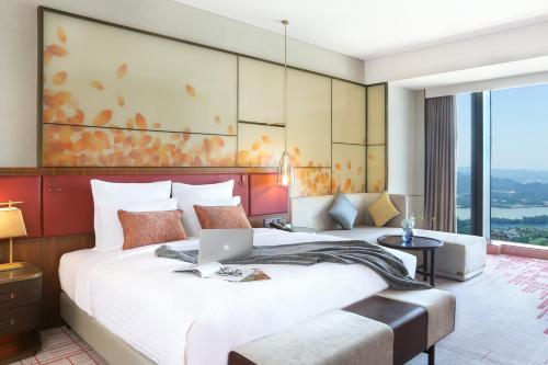 Imagen de la habitación del Hotel Pullman Huizhou Kaisa. Foto 8