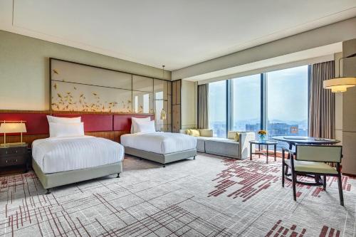 Imagen de la habitación del Hotel Pullman Huizhou Kaisa. Foto 10
