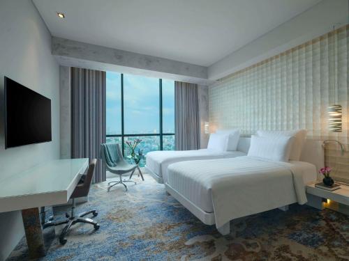 Imagen de la habitación del Hotel Pullman Jakarta Central Park. Foto 12