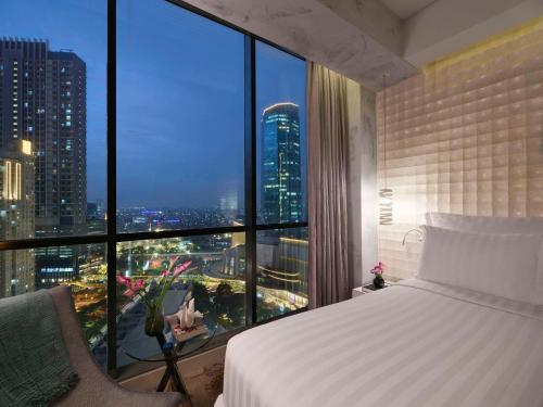 Imagen de la habitación del Hotel Pullman Jakarta Central Park. Foto 18