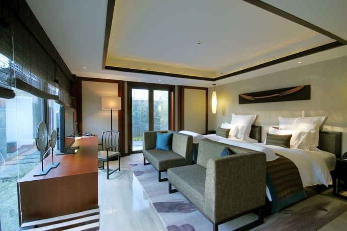 Imagen de la habitación del Hotel Pullman Lijiang Resort and Spa. Foto 6