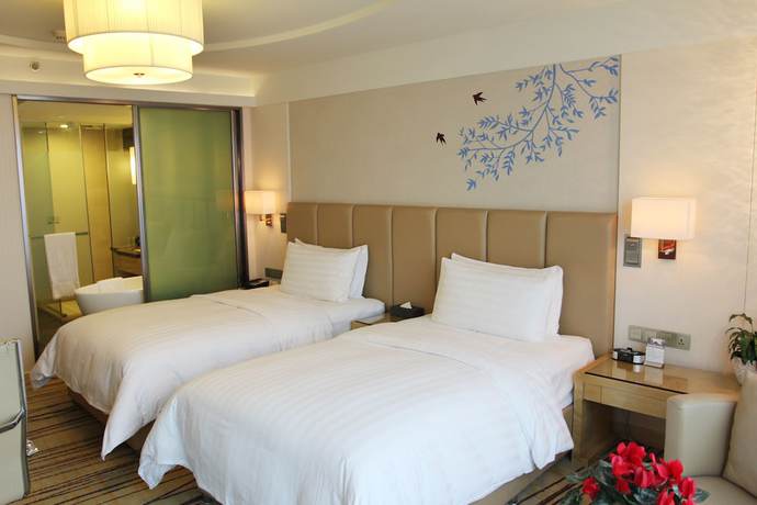 Imagen de la habitación del Hotel Pullman Linyi Lushang. Foto 2