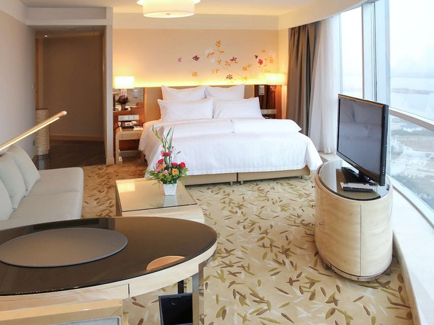 Imagen de la habitación del Hotel Pullman Linyi Lushang. Foto 9