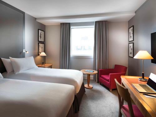 Imagen de la habitación del Hotel Pullman Paris La Défense. Foto 6