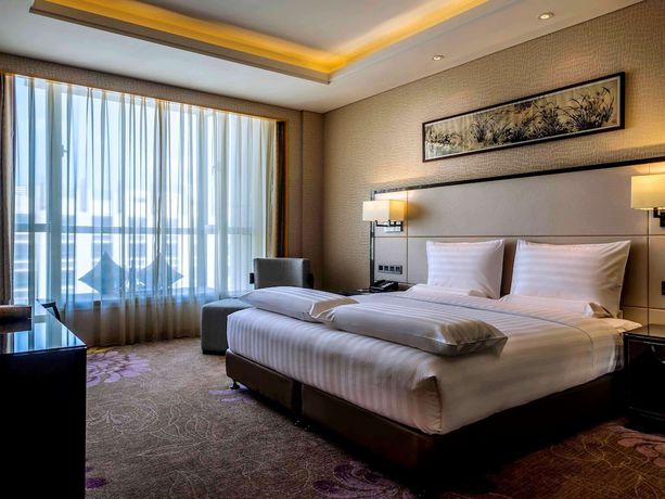Imagen de la habitación del Hotel Pullman Qingdao Ziyue. Foto 4