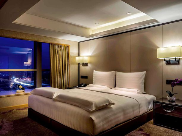 Imagen de la habitación del Hotel Pullman Qingdao Ziyue. Foto 5