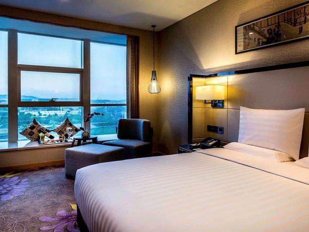 Imagen de la habitación del Hotel Pullman Qingdao Ziyue. Foto 9