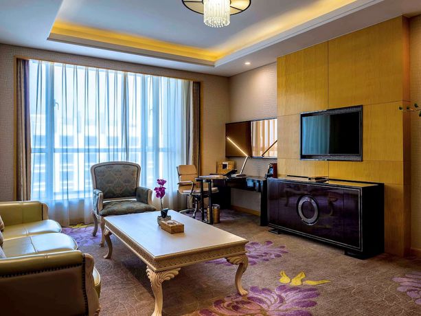 Imagen de la habitación del Hotel Pullman Qingdao Ziyue. Foto 10