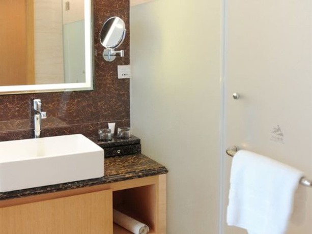 Imagen de la habitación del Hotel Pullman Qingdao Ziyue. Foto 14