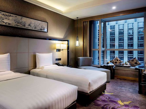 Imagen de la habitación del Hotel Pullman Qingdao Ziyue. Foto 16