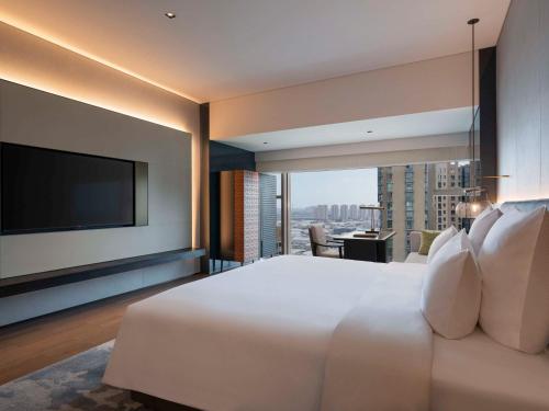 Imagen de la habitación del Hotel Pullman Quanzhou Shuitou. Foto 10