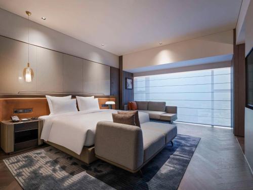 Imagen de la habitación del Hotel Pullman Quanzhou Shuitou. Foto 14