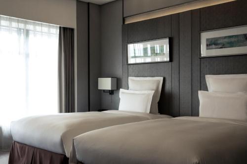 Imagen de la habitación del Hotel Pullman Shanghai Xuhui. Foto 9