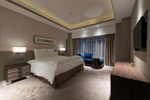 Imagen de la habitación del Hotel Pullman Shanghai Xuhui. Foto 10