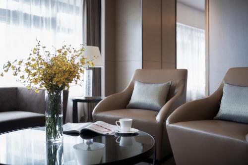 Imagen de la habitación del Hotel Pullman Shanghai Xuhui. Foto 12