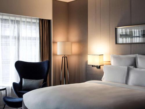 Imagen de la habitación del Hotel Pullman Shanghai Xuhui. Foto 14
