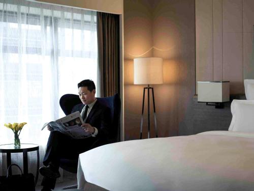Imagen de la habitación del Hotel Pullman Shanghai Xuhui. Foto 20