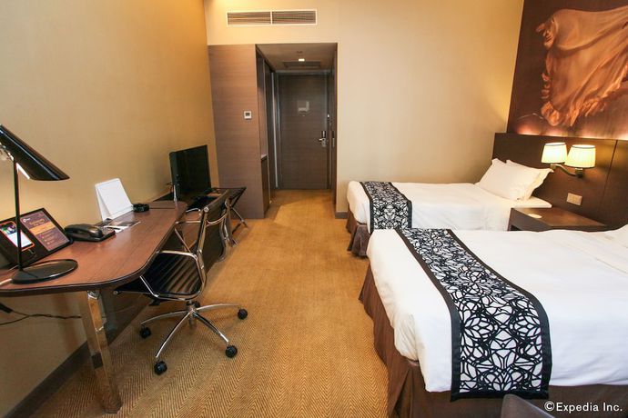 Imagen de la habitación del Hotel Pullman Singapore Orchard. Foto 2