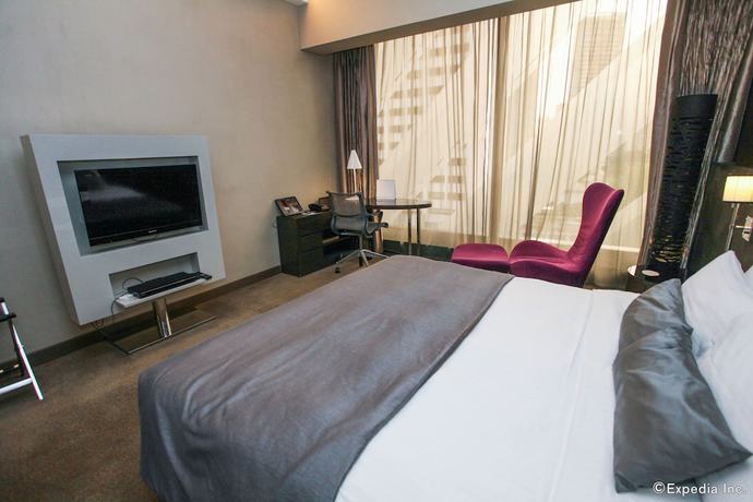 Imagen de la habitación del Hotel Pullman Singapore Orchard. Foto 8