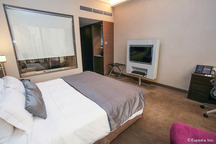 Imagen de la habitación del Hotel Pullman Singapore Orchard. Foto 9