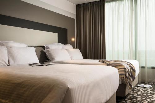 Imagen de la habitación del Hotel Pullman Sydney Airport. Foto 19