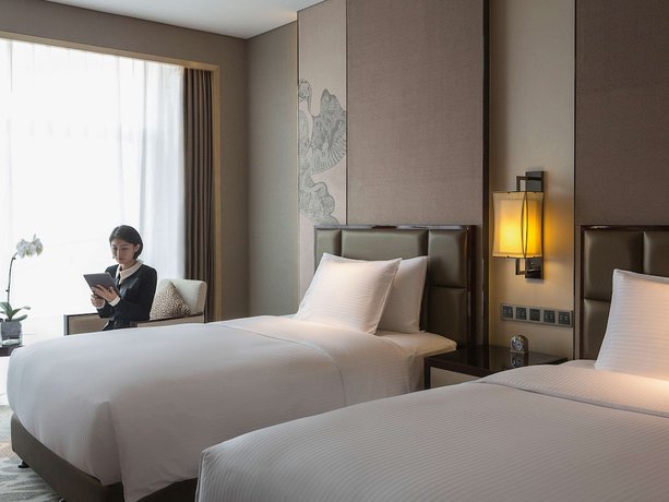Imagen de la habitación del Hotel Pullman Weifang. Foto 5