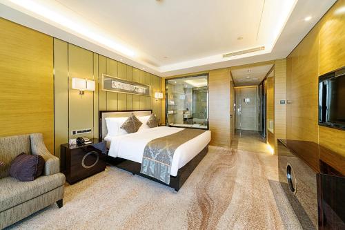 Imagen de la habitación del Hotel Pullman Wuxi New Lake. Foto 9