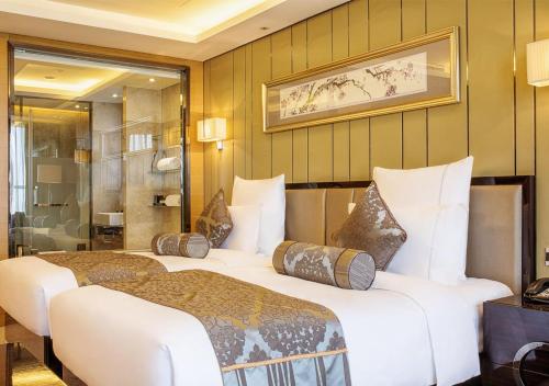 Imagen de la habitación del Hotel Pullman Wuxi New Lake. Foto 13