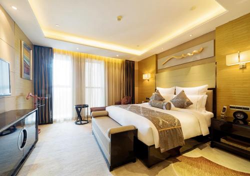 Imagen de la habitación del Hotel Pullman Wuxi New Lake. Foto 14