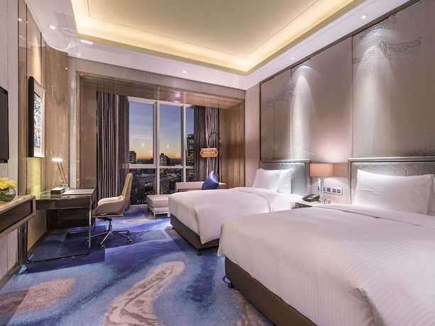 Imagen de la habitación del Hotel Pullman Yantai Center. Foto 11