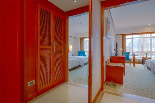 Imagen de la habitación del Hotel Pullman Zhangjiajie. Foto 14