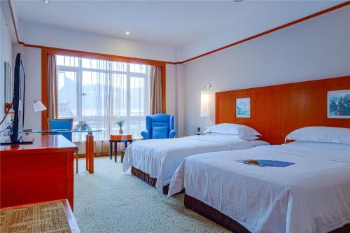 Imagen de la habitación del Hotel Pullman Zhangjiajie. Foto 19