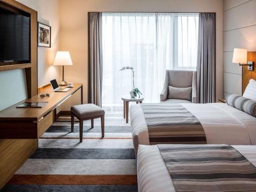 Imagen de la habitación del Hotel Pullman Zhuhai. Foto 19