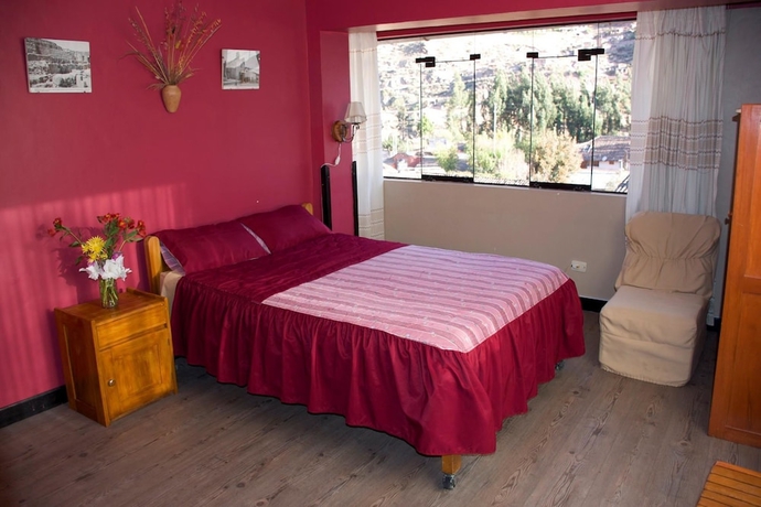 Imagen de la habitación del Hotel Pumawanka Hostal. Foto 12