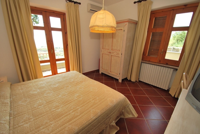 Imagen de la habitación del Hotel Punta Chiarito Resort. Foto 8