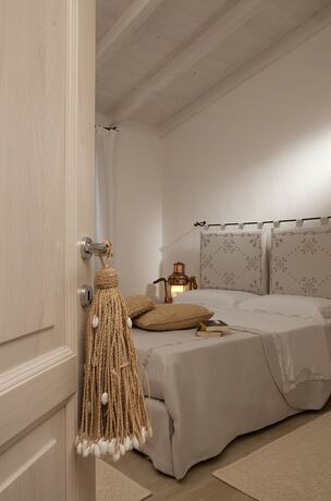 Imagen de la habitación del Hotel Punta Falcone Resort. Foto 11