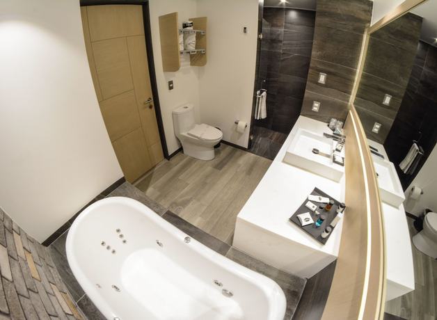 Imagen de la habitación del Hotel Punto MX. Foto 12