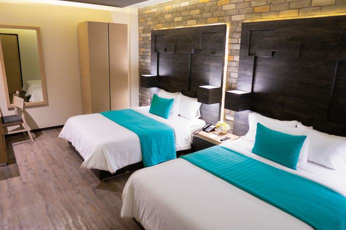 Imagen de la habitación del Hotel Punto MX. Foto 16