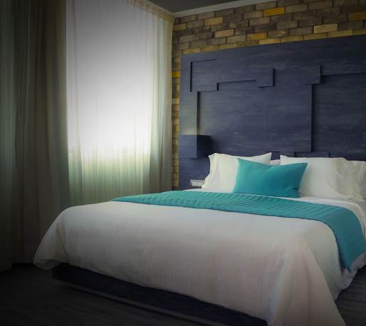 Imagen de la habitación del Hotel Punto MX. Foto 17