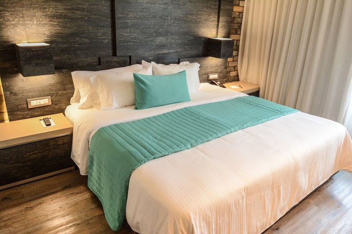 Imagen de la habitación del Hotel Punto MX. Foto 19