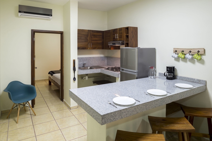 Imagen de la habitación del Hotel Punto Mita Suites. Foto 11